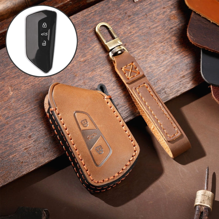 Brown cowhide leather key fob protective cover with stitched edges and logo panel