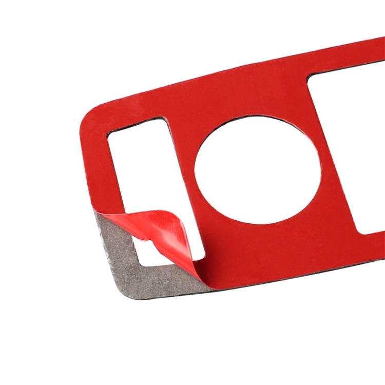 Red-backed sticker backing with circular and rectangle cutouts for carbon fiber trim