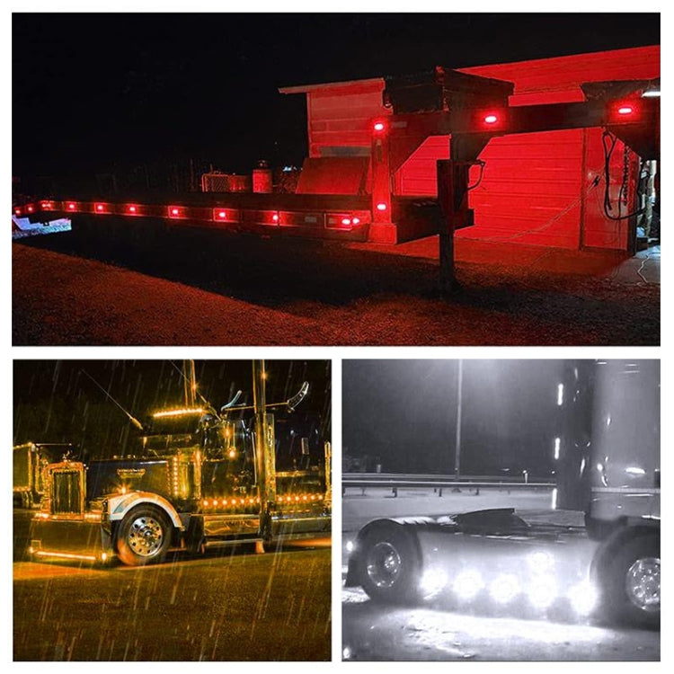 Red side marker lights illuminated on a truck, visible along the vehicle side