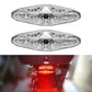 Motorcycle LED running light with clear lens and black housing, illuminated red brake glow