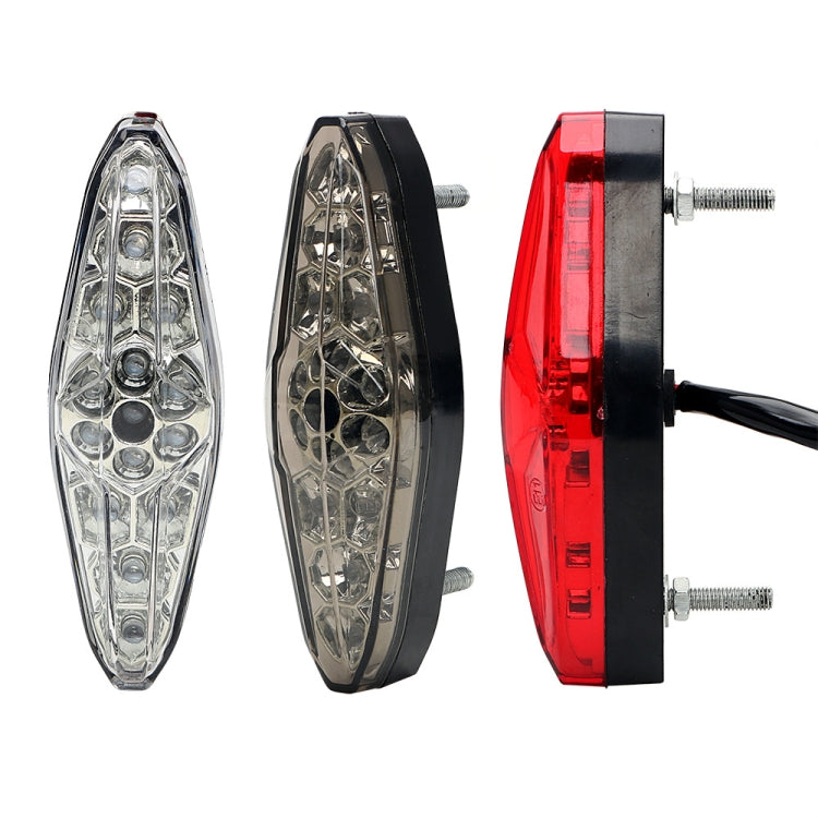 Motorcycle LED light components: clear, black, and red lenses with mounting hardware