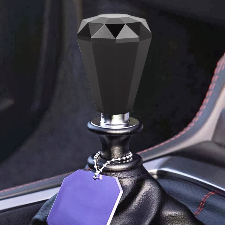 Diamond-faceted gear shift knob in gray with metal base and ring
