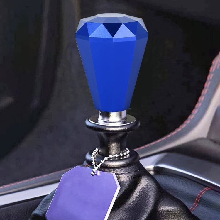 Diamond-faceted gear shift knob in blue with metal base and ring