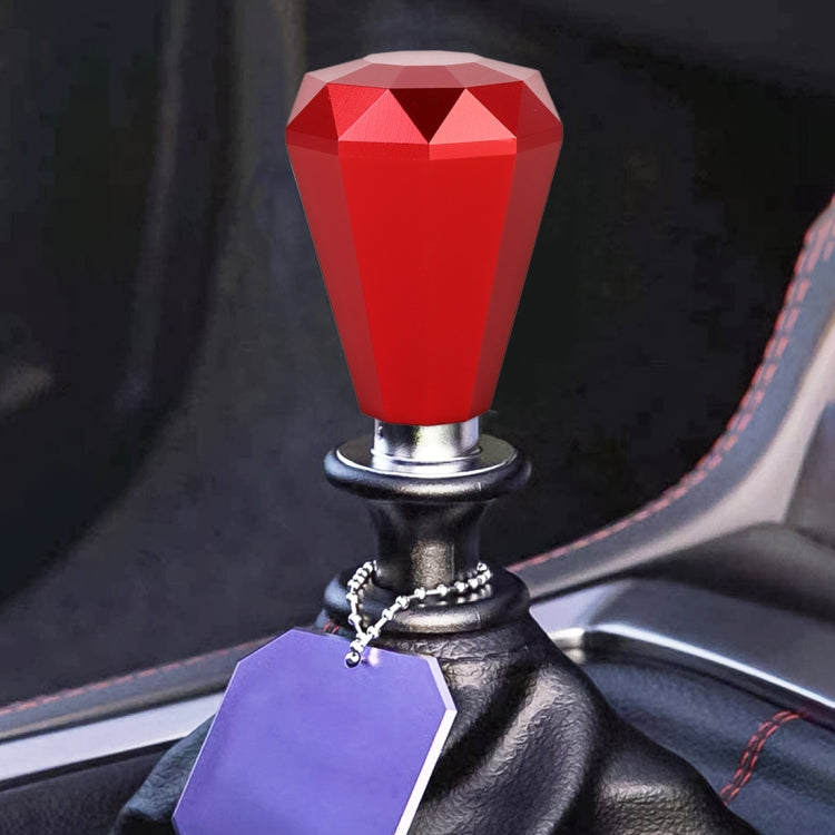 Diamond-faceted gear shift knob in red with metal base and ring