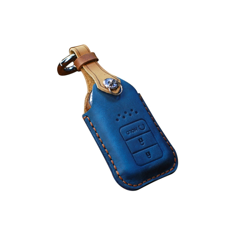 Blue leather key fob cover with brown top strap and metal keyring loop
