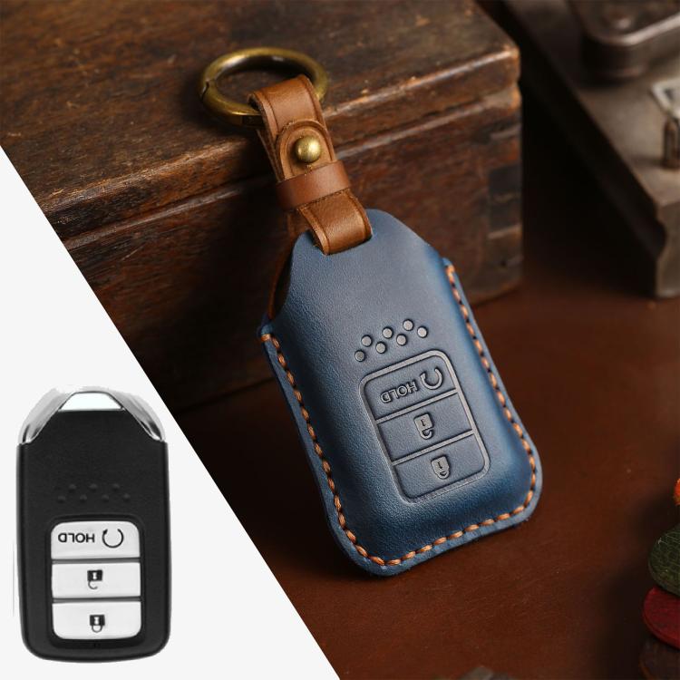 Blue leather key fob protective cover with stitched edges and metal keyring loop