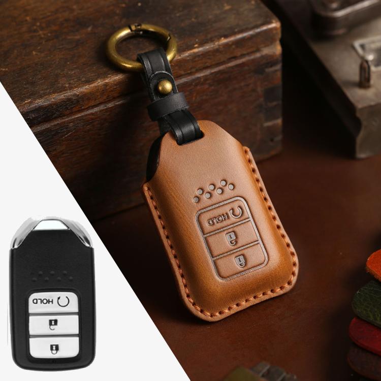 Brown leather key fob protective cover with stitched edges and metal keyring loop