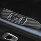 Carbon fiber window switch trim sticker installed on car door armrest