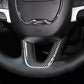 Installed carbon fiber steering wheel chin trim insert, black weave pattern