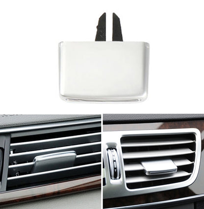 A/C vent tab clip repair plug with gray cover and two black mounting prongs