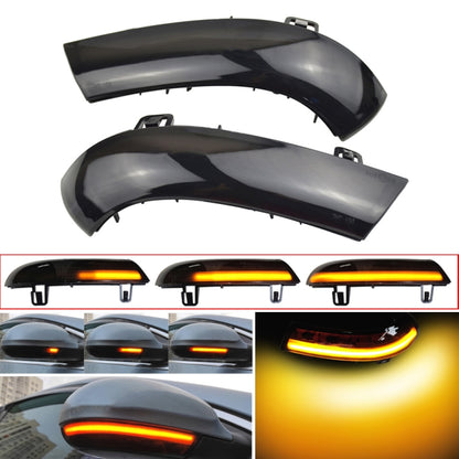 Pair of black car mirror LED turn signal lights with amber light strip