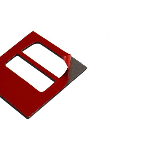 Adhesive trim backing piece with rectangular cutout, red front and dark rear