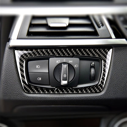 Carbon fiber headlight switch decorative sticker with cutout for control buttons