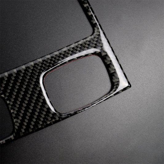 Carbon fiber rear air vent trim sticker close-up with surrounding bezel