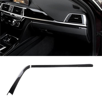 Carbon fiber center control decorative sticker strip on car dashboard trim