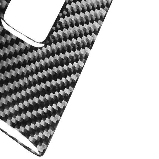 Close-up carbon fiber-look trim sticker with woven pattern and curved edge