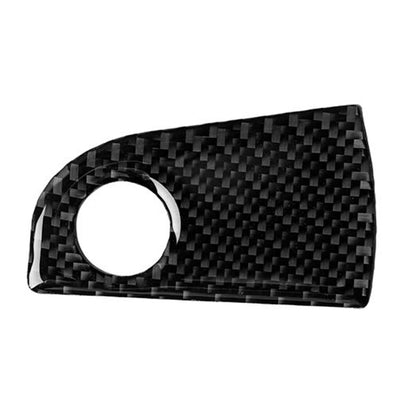 Black carbon-fiber style passenger seat storage trim sticker with round cutout