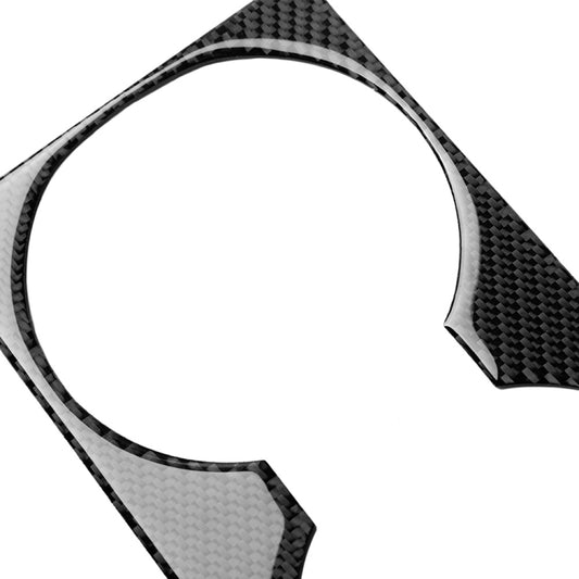 Carbon fiber cup holder panel sticker, close-up of curved edge and circular opening.