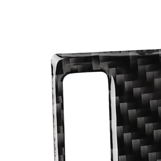 Close-up of black carbon fiber air outlet panel sticker with center rectangular cutout