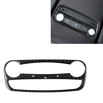 Carbon fiber reading light trim sticker with cutouts, installed on car dashboard panel