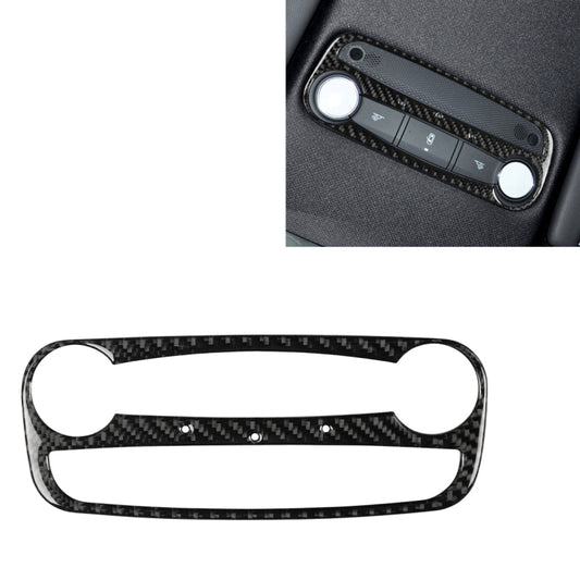 Carbon fiber reading light trim sticker with cutouts, installed on car dashboard panel