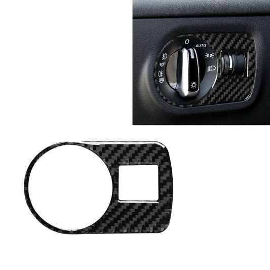 Carbon fiber headlight switch trim sticker on dashboard control panel, left drive