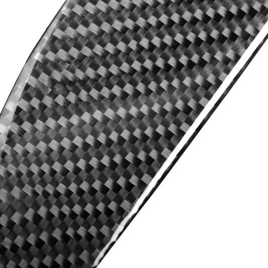Close-up carbon fiber pattern strip with glossy black weave and silver border edge