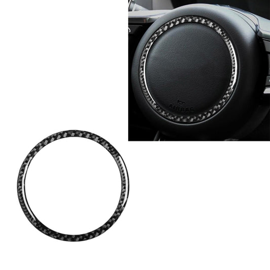 Black carbon-fiber steering wheel logo sticker ring with checkered pattern, circular cutout
