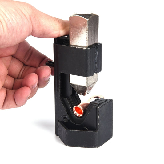 Hammer lug crimper tool holding a copper tube terminal in the die
