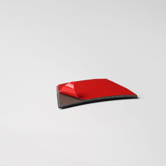 Carbon fiber steering wheel sticker with red backing and black textured surface