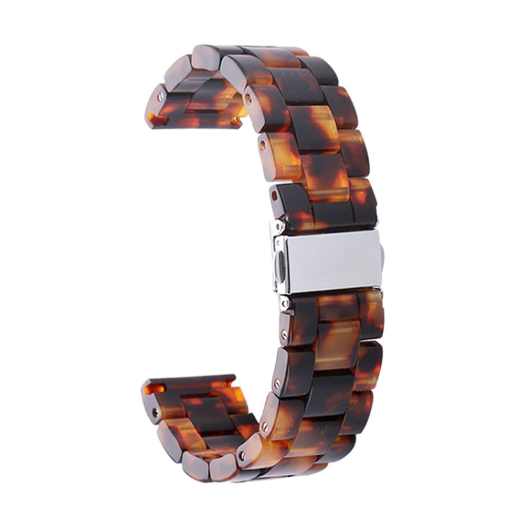 Tortoiseshell resin watch strap with silver clasp and segmented link band