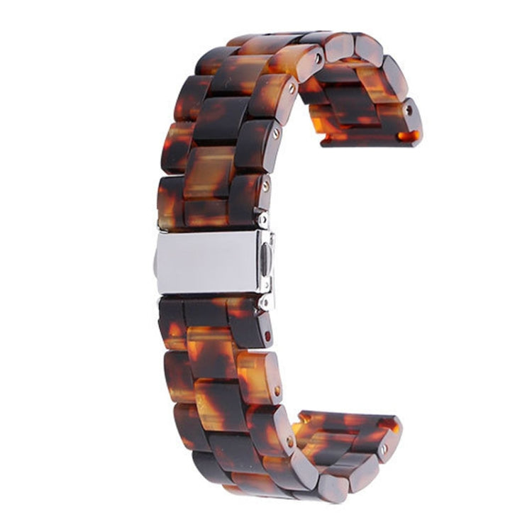 Tortoiseshell resin watch strap with silver buckle and connected pin links