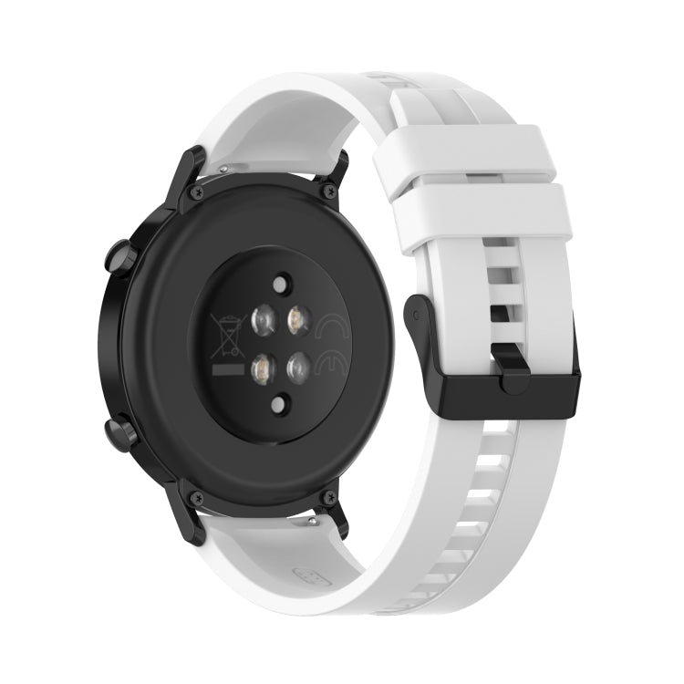 White silicone watch strap with black buckle, shown from back side