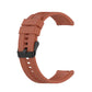 Orange-brown silicone watch strap with black buckle and adjustable pin holes