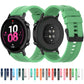 Green silicone watch strap set with black buckles and side button cutouts