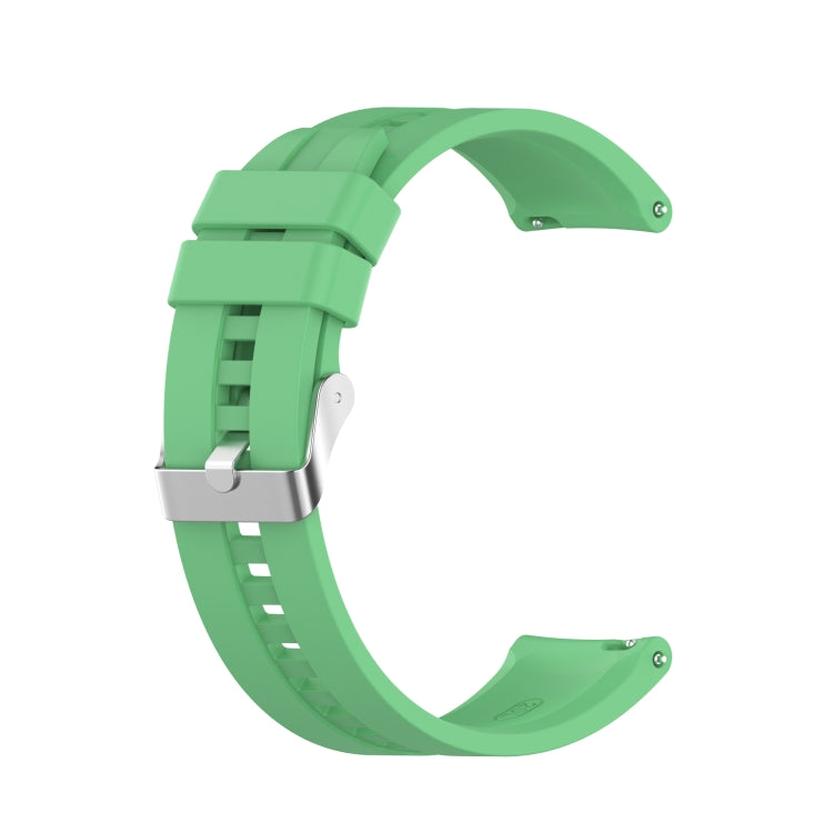 Mint green silicone watch strap with silver-tone buckle and adjustable pin holes