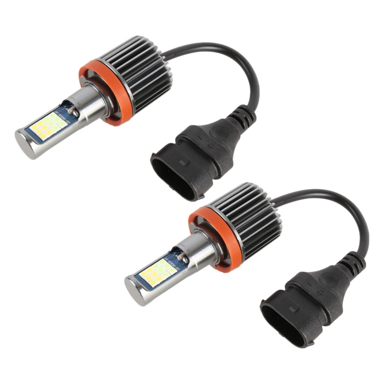 Pair of LED fog light bulbs with orange heat sinks and black wiring harness