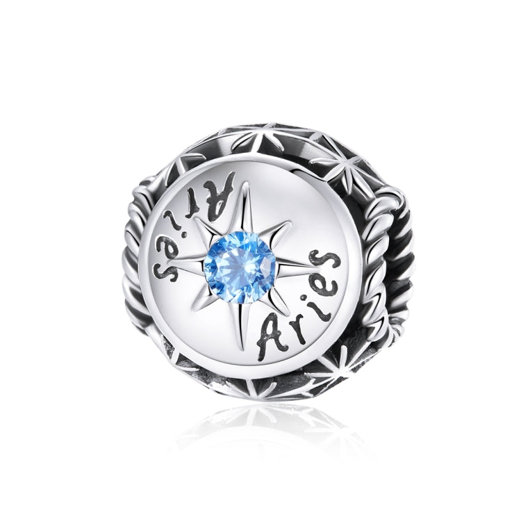 Sterling silver zodiac ring with light blue zircon center and engraved constellation symbols