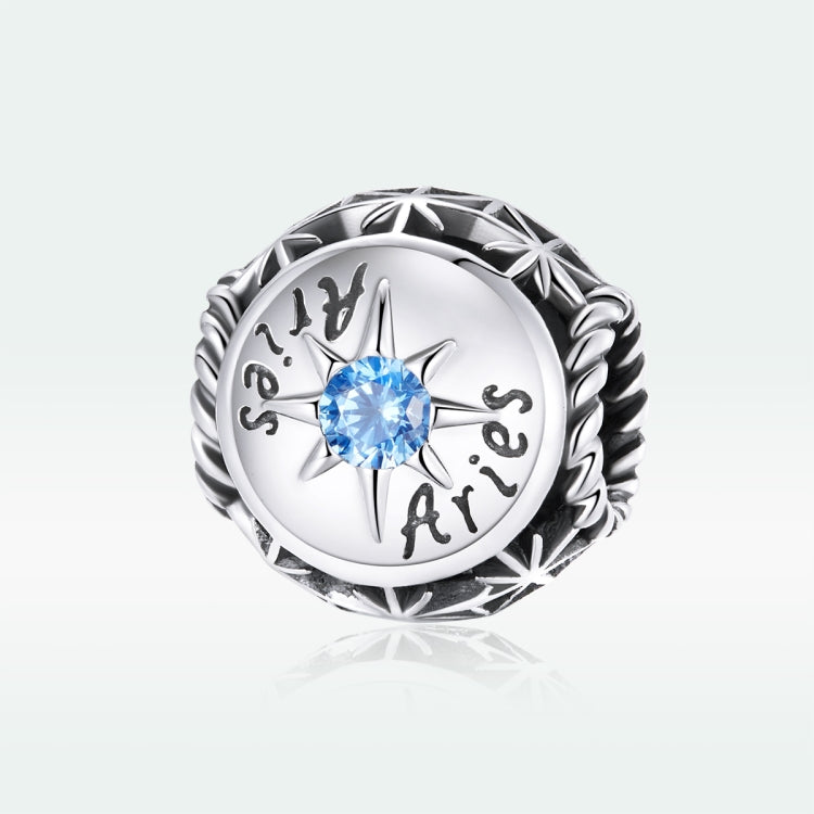 Sterling silver zodiac ring with light blue zircon center, starburst bezel, engraved dates