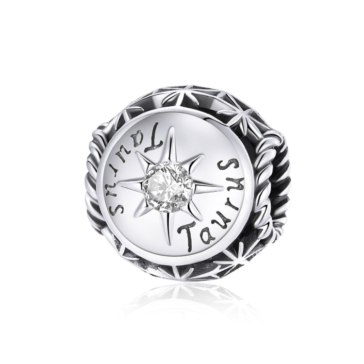 Sterling silver zodiac ring with clear zircon center, starburst bezel, engraved zodiac symbols