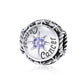 Sterling silver zodiac ring with purple zircon center, starburst bezel, engraved zodiac script