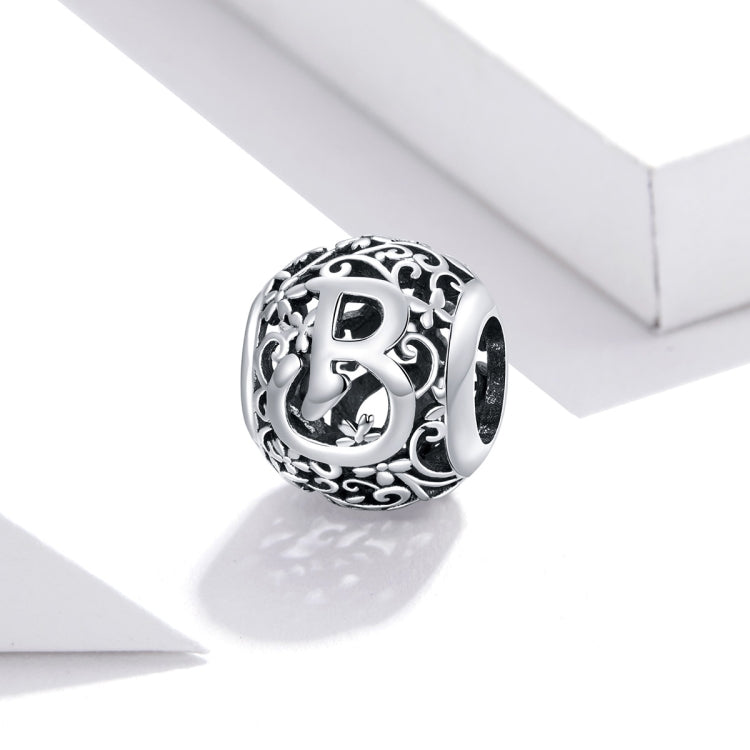 Sterling silver letter charm bead with ornate cutout B and decorative flourishes