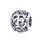 Sterling silver letter charm bead with ornate cutout E and curled floral scrollwork