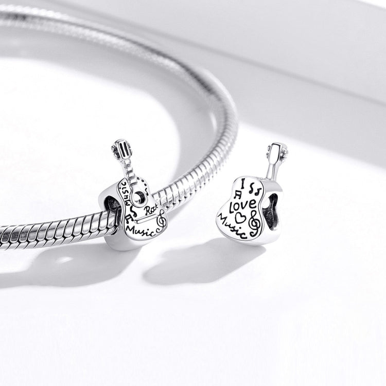 Sterling silver charm bracelet with guitar bead charm and heart love charm