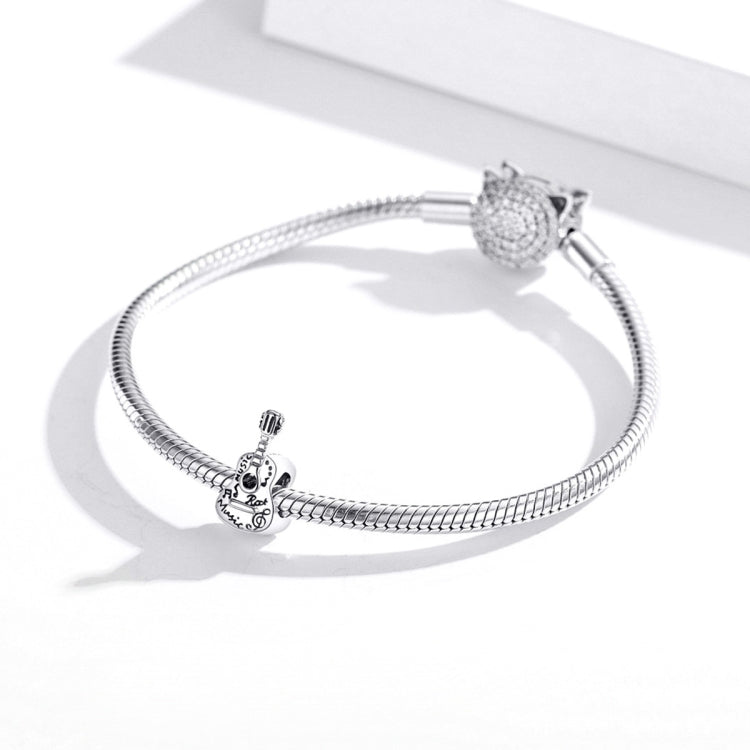 Sterling silver snake chain bracelet with guitar charm and round bead clasp