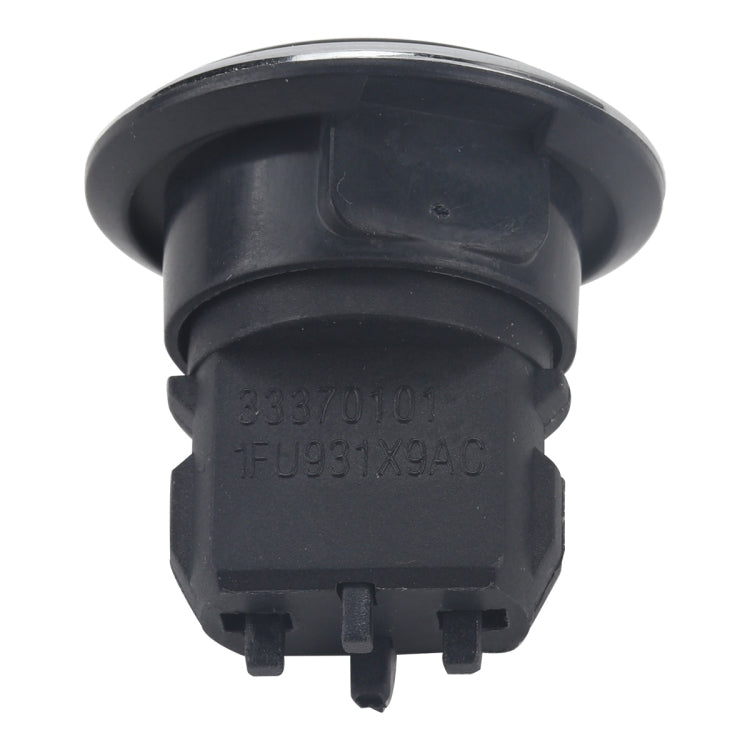 Engine start/stop push button switch rear view with black housing and visible molded connector pins