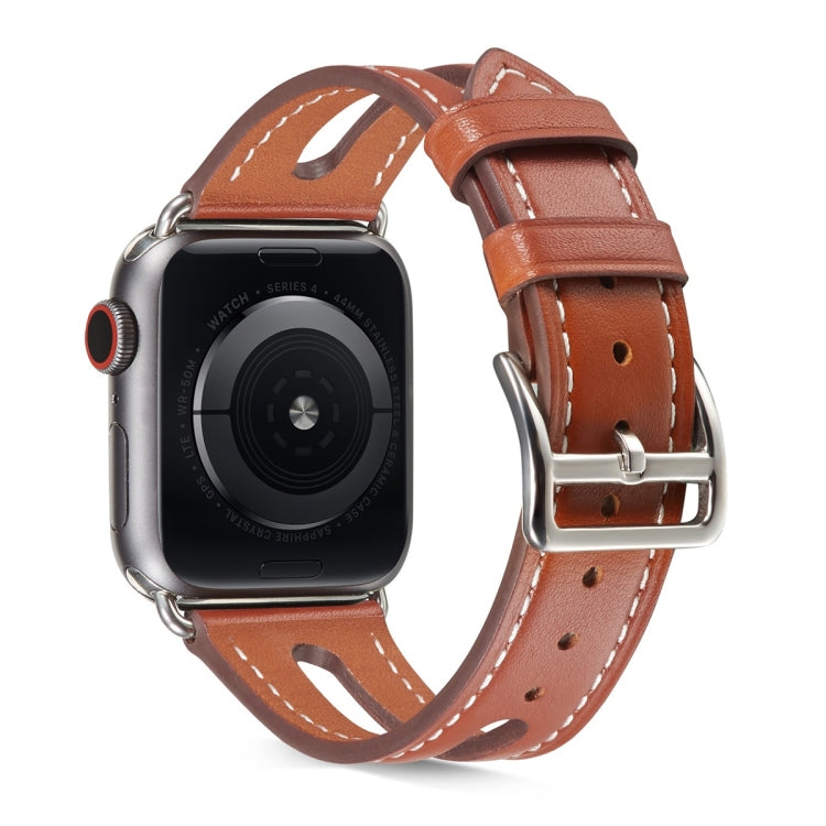 Light brown leather Apple Watch band with metal buckle; stitched holes and keeper