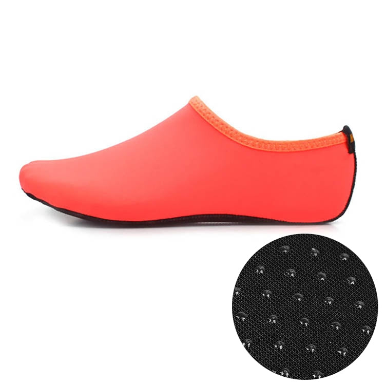 Orange slip-on dive shoes with textured non-slip sole insert