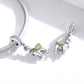 Silver snake-chain bracelet with dangling alpaca charms and CZ-studded details