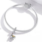 Silver snake-chain bracelet with CZ clasp and dangling alpaca charm